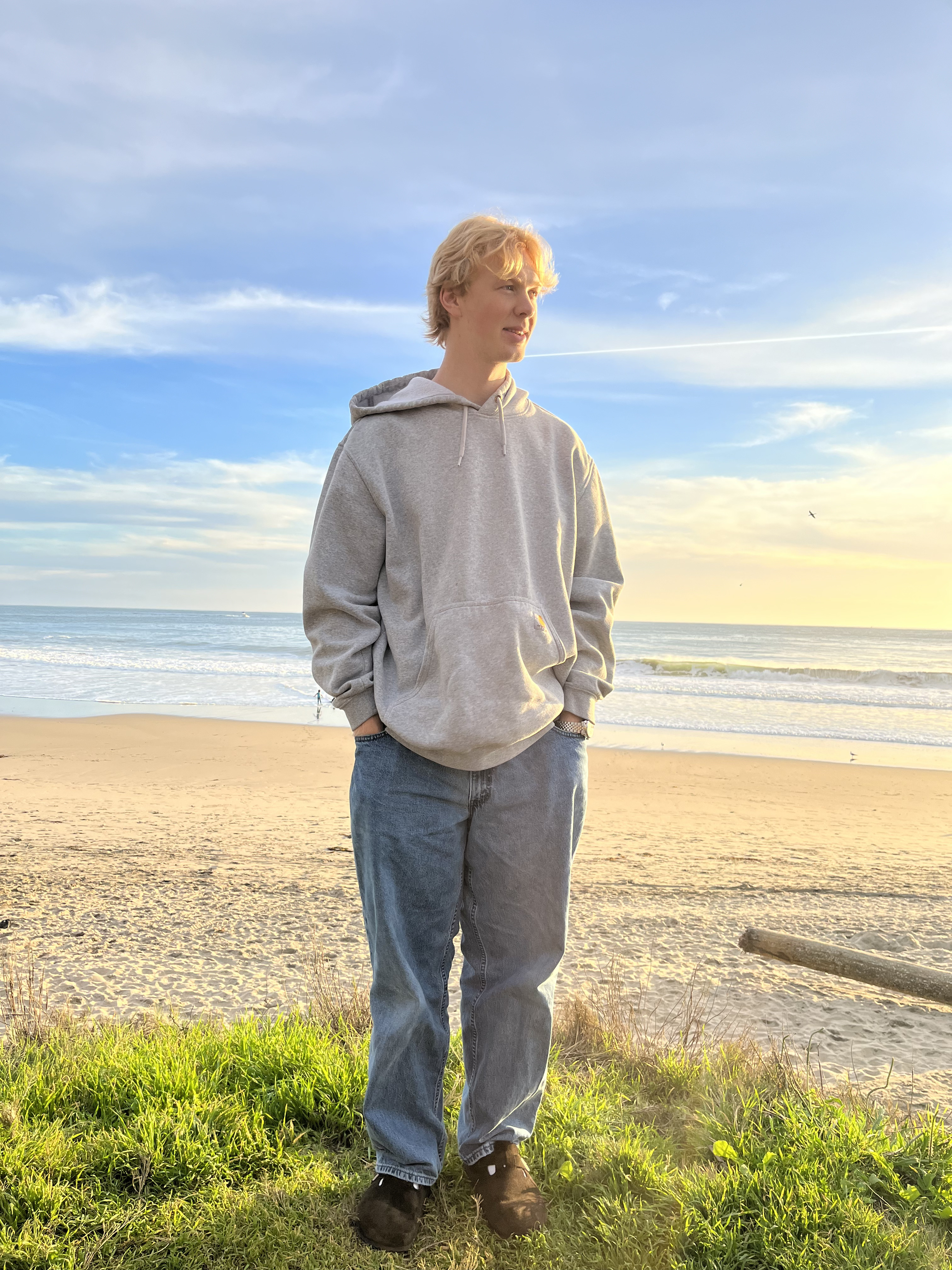 A photo of Ryan looking whimsical at Blacks Beach in Santa Cruz, CA.